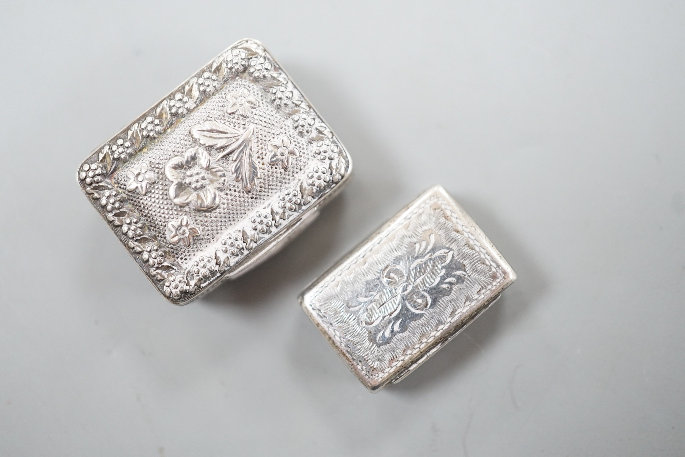 A George IV silver vinaigrette, embossed with flowers and flower heads, Ledsam & Vale?, Birmingham, 1820, 25mm and one other smaller Victorian silver vinaigrette, by Edward Smith.
